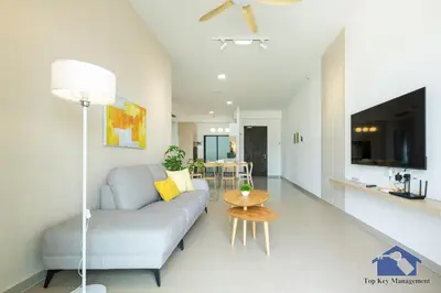 a living room with a couch and a table at Sunshine Residence Suites in Ayer Itam