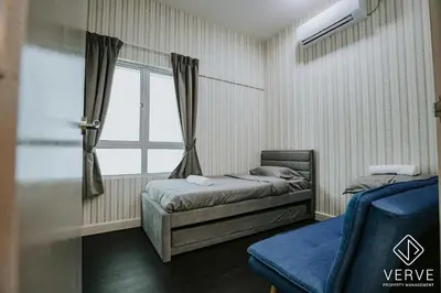 a bedroom with two beds and a window at Ipoh Residence PR1MA Kepayang 6 pax suites in Ipoh