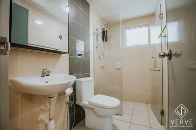 a bathroom with a toilet and a sink and a shower at Ipoh Residence PR1MA Kepayang 6 pax suites in Ipoh