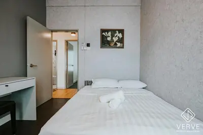 a bedroom with a bed with two white pillows at Ipoh Residence PR1MA Kepayang 6 pax suites in Ipoh