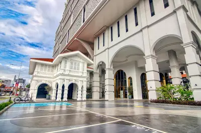 a building with a basketball court in front of it at 22 Macalisterz Premium Suites Penang by BYON in George Town