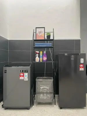 two refrigerators sitting next to each other in a room at Homestay Bonda F in TanjongMalim