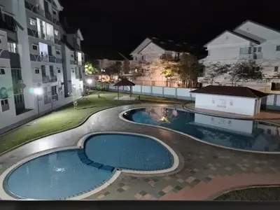 a view of a swimming pool at night at MK Homestay Sunway in Ipoh