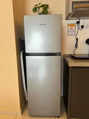 a refrigerator in a kitchen with a plant on top at Horizon Ipoh 8Pax 3R2B - Tropical Bird's Retreat in Ipoh