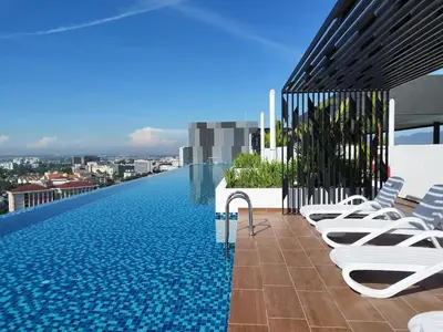 a swimming pool on the roof of a building at Horizon Ipoh 8Pax 3R2B - Tropical Bird's Retreat in Ipoh