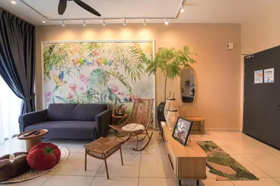 a living room with a couch and a painting on the wall at Horizon Ipoh 8Pax 3R2B - Tropical Bird's Retreat in Ipoh