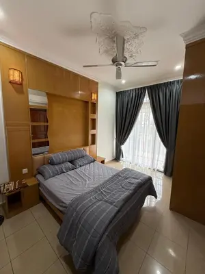 a bedroom with a bed and a ceiling fan at Majestic Bungalow Seberang Jaya in Perai