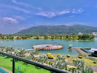 a view of a lake with mountains in the background at Homestay Marina in Lumut