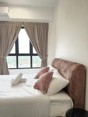 a bedroom with a bed with pillows and a window at Family Suites Netflix House Aston Acacia Bukit Mertajam in Bukit Mertajam