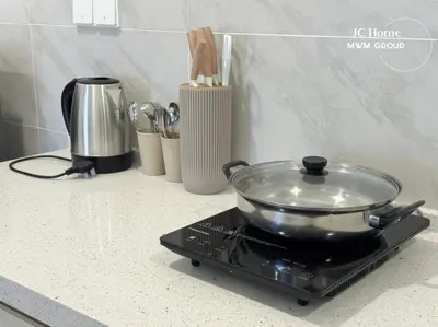 a glass pan sitting on top of a stove at Family Suites Netflix House Aston Acacia Bukit Mertajam in Bukit Mertajam