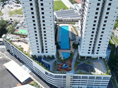 an aerial view of two tall white buildings with a pool at Family Suites Netflix House Aston Acacia Bukit Mertajam in Bukit Mertajam