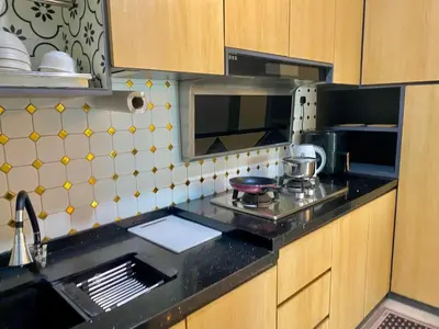 a kitchen with a sink and a counter top at Airra Minimalist Suite-Ipoh Town in Ipoh