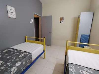 a room with two bunk beds in a room at Firza Suite in Gua Sai