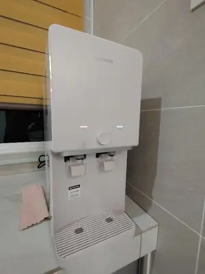 a white refrigerator freezer sitting in a bathroom at \u98ce\u4e4b\u5c45\u6c11\u5bbf Windstay in Raub