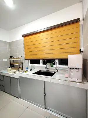 a kitchen with a sink and a counter top at \u98ce\u4e4b\u5c45\u6c11\u5bbf Windstay in Raub