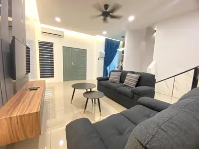 a living room with a couch and a table at 38G Homestay in Teluk Intan