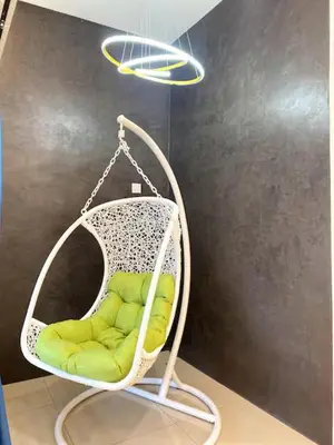 a white swing with a green seat in a room at 38G Homestay in Teluk Intan