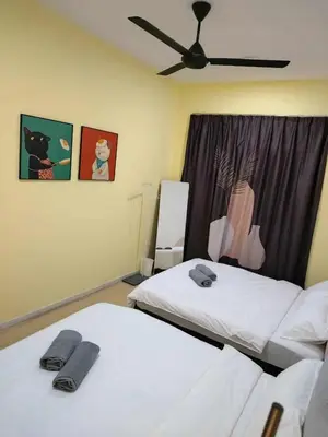 a bedroom with two beds and a ceiling fan at Nordic Haven \u5317\u6b27\u6696\u5c45 in Taiping