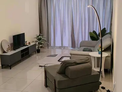 a living room with a couch and a chair and a television at Nordic Haven \u5317\u6b27\u6696\u5c45 in Taiping
