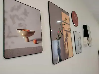 a wall with pictures and a bowl and a clock at Nordic Haven \u5317\u6b27\u6696\u5c45 in Taiping