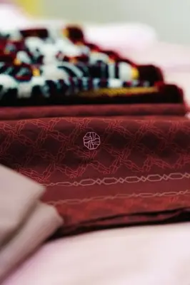 two red wallets sitting next to each other at Villa Cinta Jasmeen in Kuala Kangsar