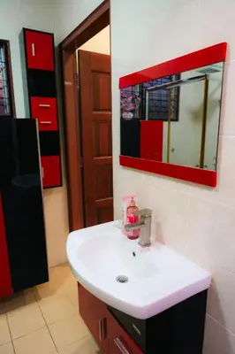 a bathroom with a sink and a mirror at Villa Cinta Jasmeen in Kuala Kangsar