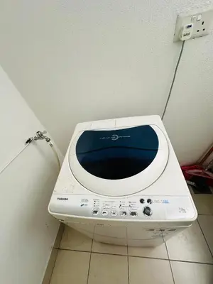a microwave sitting on the floor in a room at Southbay Seaview Condo A31 #10minQueensbay in Bayan Lepas