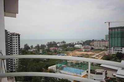 a view of a city from the balcony of a building at Eden Seaview in Batu Ferringhi