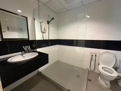 a bathroom with a toilet and a sink at Mansion One Seaview Studio 4 pax Gurney in George Town