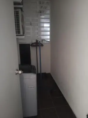 a small bathroom with a sink and a trash can at Little sweet homestay in Ipoh