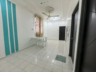 a living room with a table and a table at Queen Bed Budget Room in Padang Serai