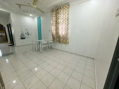 a dining room with a table and a window at Queen Bed Budget Room in Padang Serai