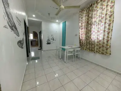a dining room with a table and a window at Queen Bed Budget Room in Padang Serai