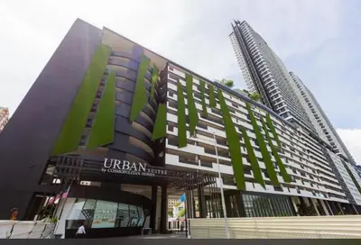 a large building with a building with a tallraper at Georgetown 2BR Luxury Condo Unbeatable Night View Infinity Pool Attractions Food Fully Equipped#148B in Bayan Lepas