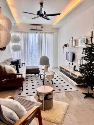 a living room with a couch and a ceiling fan at Dandelion 3BR Apt Near lake garden in Taiping