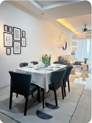 a dining room with a table and chairs at Dandelion 3BR Apt Near lake garden in Taiping