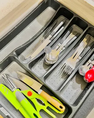 a tray with knives and utensils in a drawer at CozyVista Suites Marina Island Lumut Perak in Gua Sai