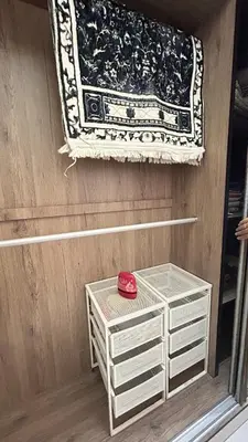 a rug hanging on a wall next to a shelf at Mimi's Nest - Fully furnished, wifi at Tronoh in Teronoh
