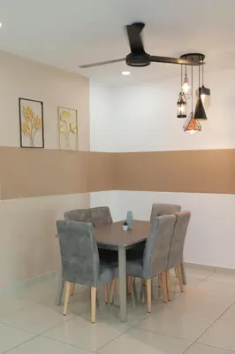 a dining room with a table and chairs at Palette & Pool Haven in Ipoh