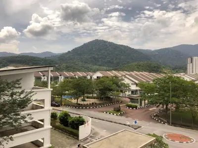a view of a town with mountains in the background at Palette & Pool Haven in Ipoh