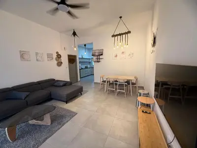 a living room with a couch and a table at 2 Storey Terrace 39 night market in Brinchang