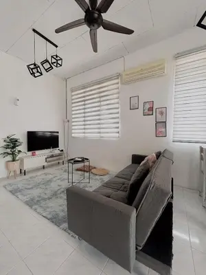 a living room with a couch and a ceiling fan at 11Acozy#6pax#singlestoreyhouseAlmaBukitMertajam in Bukit Mertajam