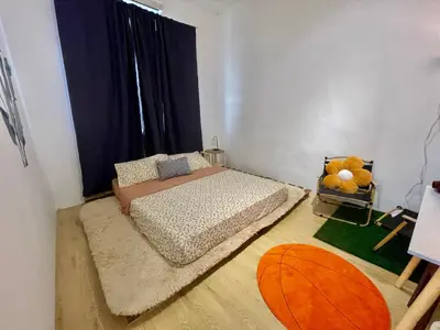 a bedroom with a bed and a large window at 11Acozy#6pax#singlestoreyhouseAlmaBukitMertajam in Bukit Mertajam