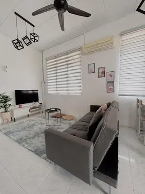 a living room with a couch and a ceiling fan at 11Acozy#6pax#singlestoreyhouseAlmaBukitMertajam in Bukit Mertajam