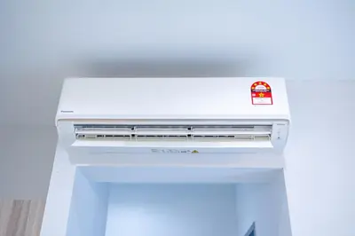 a white stove top oven with a sticker on it at IconicRegency #3BR #USM #Queensbay #Airport in Bayan Lepas