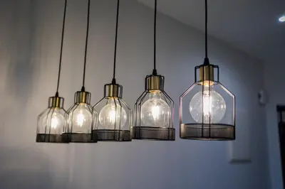a group of glass bottles hanging from a wall at IconicRegency #3BR #USM #Queensbay #Airport in Bayan Lepas