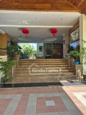 a staircase in a building with red lanterns at RinduTamu Homestay in Lumut