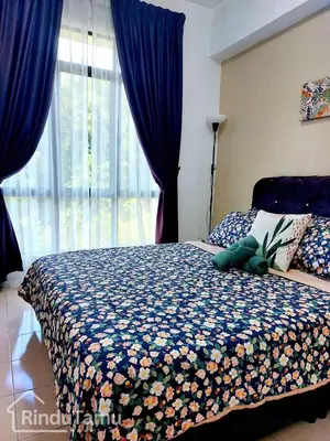 a bedroom with a bed with blue curtains and a window at RinduTamu Homestay in Lumut