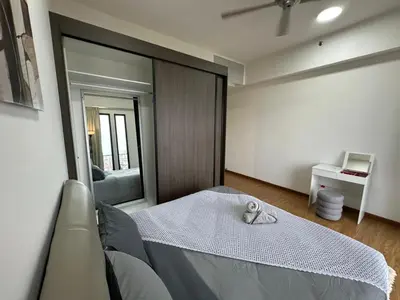 a bedroom with a bed and a large mirror at HOT & Modern 2BR Beacon Executive Suite, Georgetown in George Town