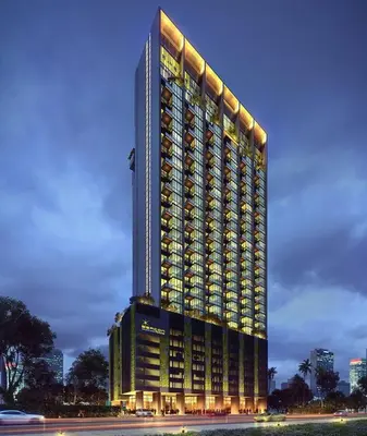 a tall building with lights on the side of it at HOT & Modern 2BR Beacon Executive Suite, Georgetown in George Town